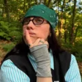Person in nature wearing green bandana.