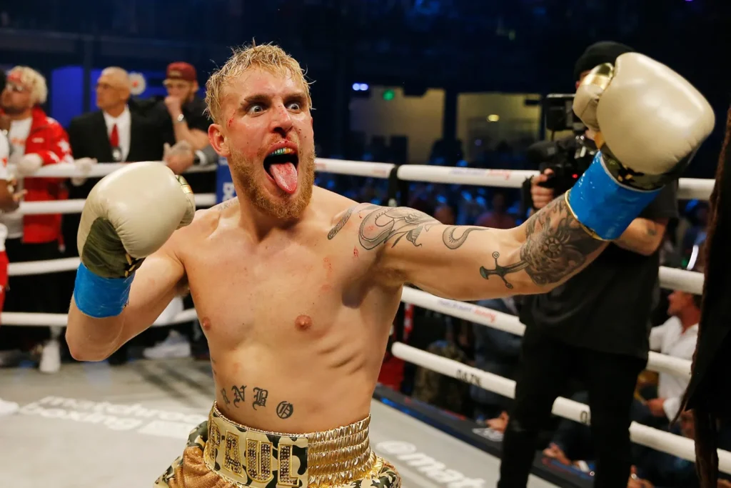 Former two-time unified heavyweight champion Anthony Joshua is poised to earn a massive £70 million from a highly anticipated, professional heavyweight boxing match against YouTuber-turned-boxer Jake Paul, with sources reporting that the total prize pot is expected to reach an astonishing £140 million. The contest is reportedly close to being finalized and is being positioned as a 50-50 financial split between the two fighters, marking one of the most lucrative single-fight purses in British boxing history for Joshua. The bout is being rushed into development after Paul’s scheduled fight with Gervonta Davis was cancelled, and Joshua’s camp saw an opportunity for a career-high payday ahead of his long-term goal of a 2026 clash with Tyson Fury. The monumental financial figures, which would surpass Joshua's previous highest earnings, including the reported £30 million from his victory over Francis Ngannou, are largely driven by the massive global appeal of both fighters, particularly the digital reach of Paul. Reports suggest the match is expected to be broadcast live globally on Netflix, which previously aired Paul's high-profile bout with Mike Tyson in 2024, an event that drew a staggering audience exceeding 60 million viewers and cemented the streaming platform's venture into live combat sports. The contest is currently being finalized for a date in December 2025, with the most frequently cited target being December 19 in Miami, Florida. Despite the widespread media reports of a "done deal," Joshua’s promoter, Eddie Hearn, has urged caution, stating that while talks are real and advanced, the agreement is not yet fully confirmed. Hearn acknowledged the colossal financial incentive, stating the opportunity would allow Joshua to make "50 times more money" than a standard warm-up fight, making the decision difficult for any athlete to reject, regardless of the criticism it might draw regarding Joshua's boxing legacy. The contest is expected to be a professional heavyweight fight under Queensberry rules, meaning the result will count on both men's official records, with the vast difference in size and experience—Joshua being a two-time world champion and a true heavyweight, and Paul being a relatively untested cruiserweight stepping up—adding a highly unusual dynamic to the massive financial spectacle.