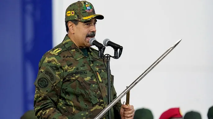 The Trump administration's dramatic seizure of a massive Venezuelan-linked oil tanker, the Skipper, in the Caribbean Sea this week has cornered President Nicolás Maduro, leaving his regime with severely limited options for retaliation against the escalating U.S. pressure campaign. The seizure, which the U.S. justifies under a judicial warrant citing the vessel's past links to an illicit oil shipping network involving Iranian and Hezbollah financing, marks a significant and unprecedented escalation targeting Caracas’s main source of income. While the Maduro government immediately condemned the action as "blatant theft and an act of international piracy," analysts say the regime is in a weak position to respond in kind due to its heavy reliance on a shadowy network of tankers to circumvent existing U.S. sanctions. The Skipper, a Very Large Crude Carrier (VLCC) carrying approximately two million barrels of Venezuelan crude, was seized by a combined force including the U.S. Coast Guard and FBI. President Trump publicly commented on the seizure, stating simply, "we keep it, I guess," signaling the intent to confiscate the oil cargo, a move that directly starves the Venezuelan government of millions in critical revenue. Maduro’s potential responses are severely constrained. Military retaliation is deemed highly improbable given the overwhelming U.S. naval presence in the Caribbean, including the USS Gerald Ford aircraft carrier. Economically, the country has little leverage, as its economy is already crippled by sanctions and a collapse in oil output. Diplomatic protests have been launched, but these have historically yielded little impact on U.S. policy. Furthermore, experts suggest the U.S. may have seized the vessel in international waters under the premise that it was falsely flagged, effectively making it "stateless" under international maritime law and thus a legitimate target for intervention. The immediate fallout has already seen several other sanctioned tankers engaged in the Venezuelan oil trade abruptly flee the area, indicating the move has severely increased the perceived risk of doing business with Caracas. This successful interception is widely viewed as a clear warning that the U.S. is willing to physically interrupt the oil trade that has sustained the regime.