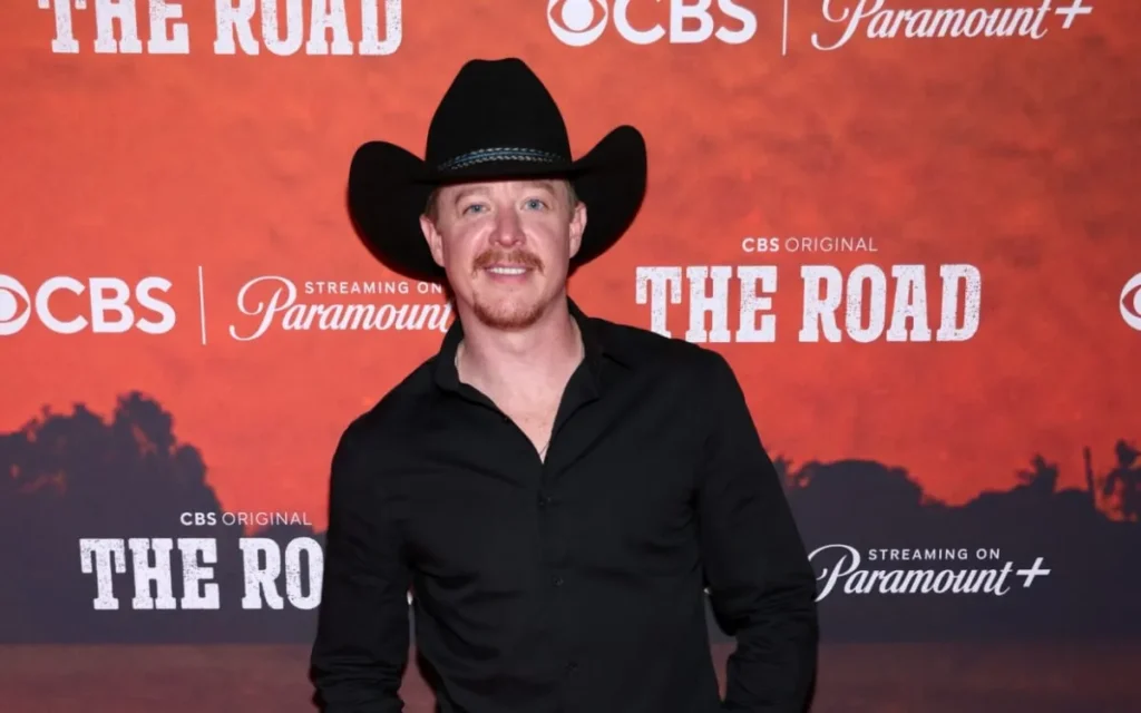 Adam Sanders Crowned Winner of ‘The Road’ Season 1 Finale in Nashville 7 Adam Sanders has officially been crowned the first-ever champion of the inaugural season of the CBS reality competition series The Road. The high-stakes finale took place on Sunday evening, December 21, 2025, at the legendary Ryman Auditorium in Nashville, Tennessee. Sanders emerged victorious after competing against fellow finalists Cassidy Daniels and Channing Wilson in a night filled with emotional performances. The audience in attendance held the ultimate power to decide the winner after watching the finalists open for country music superstar Keith Urban one last time. This victory marks a significant turning point in the career of the Florida-born singer who has spent years working as a songwriter in the music industry. His triumph concludes a grueling nine-week journey where contestants traveled across the country to prove their talent on some of the most iconic stages in the nation. The finale broadcast showcased the immense talent of the top three artists through both cover songs and original compositions. Adam Sanders delivered a powerful rendition of the Brooks and Dunn classic That Ain’t No Way to Go which drew high praise from mentor Keith Urban for its emotional depth. He followed this performance with his original track All Summer Long which energized the crowd and highlighted his skills as an engaging live performer. Meanwhile, Channing Wilson impressed the audience with his grit while Cassidy Daniels took a bold risk by performing a rock-inspired cover. Despite the stiff competition, the audience response favored the consistent energy and vocal range that Sanders brought to the Ryman stage throughout the evening. The decision was announced during the closing moments of the episode as Urban revealed the results of the live audience vote to a cheering crowd. Winning the first season of The Road comes with a life-changing grand prize that will accelerate the career of Adam Sanders. The musician will receive a cash prize of two hundred and fifty thousand dollars along with a major recording contract and a Red Bull prize package. Perhaps most notably, Sanders has secured a prestigious performance slot at the 2026 Stagecoach Country Music Festival in California. He expressed profound gratitude after the announcement stating that the victory felt like a dream come true after years of being told no in the competitive music business. His background as a songwriter for artists like Luke Bryan and Dierks Bentley provided him with a unique perspective throughout the competition. This win validates his transition from a behind-the-scenes creator to a front-and-center superstar in the making. The success of the first season of The Road has solidified the show as a major player in the television landscape. Executive producers Blake Shelton and Taylor Sheridan designed the series to focus on the raw reality of life on tour for aspiring musicians. By having contestants open for Keith Urban in various cities, the show offered a unique look at the challenges and rewards of the country music circuit. The finale at the Ryman Auditorium served as a fitting conclusion to a season that prioritized authentic talent and audience connection over traditional judging panels. As Adam Sanders begins his new chapter as a recording artist, fans are already looking forward to the future of the franchise. The impact of the series on the careers of all three finalists suggests that The Road will continue to be a vital platform for discovering the next generation of music stars.